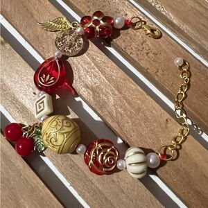 Red Beaded Charm Bracelet with Gold Accents